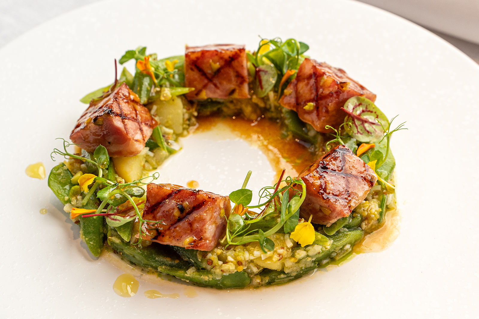 Grilled Lyonnais sausage with pistachio, green bean salad & tarragon-flavored potatoes